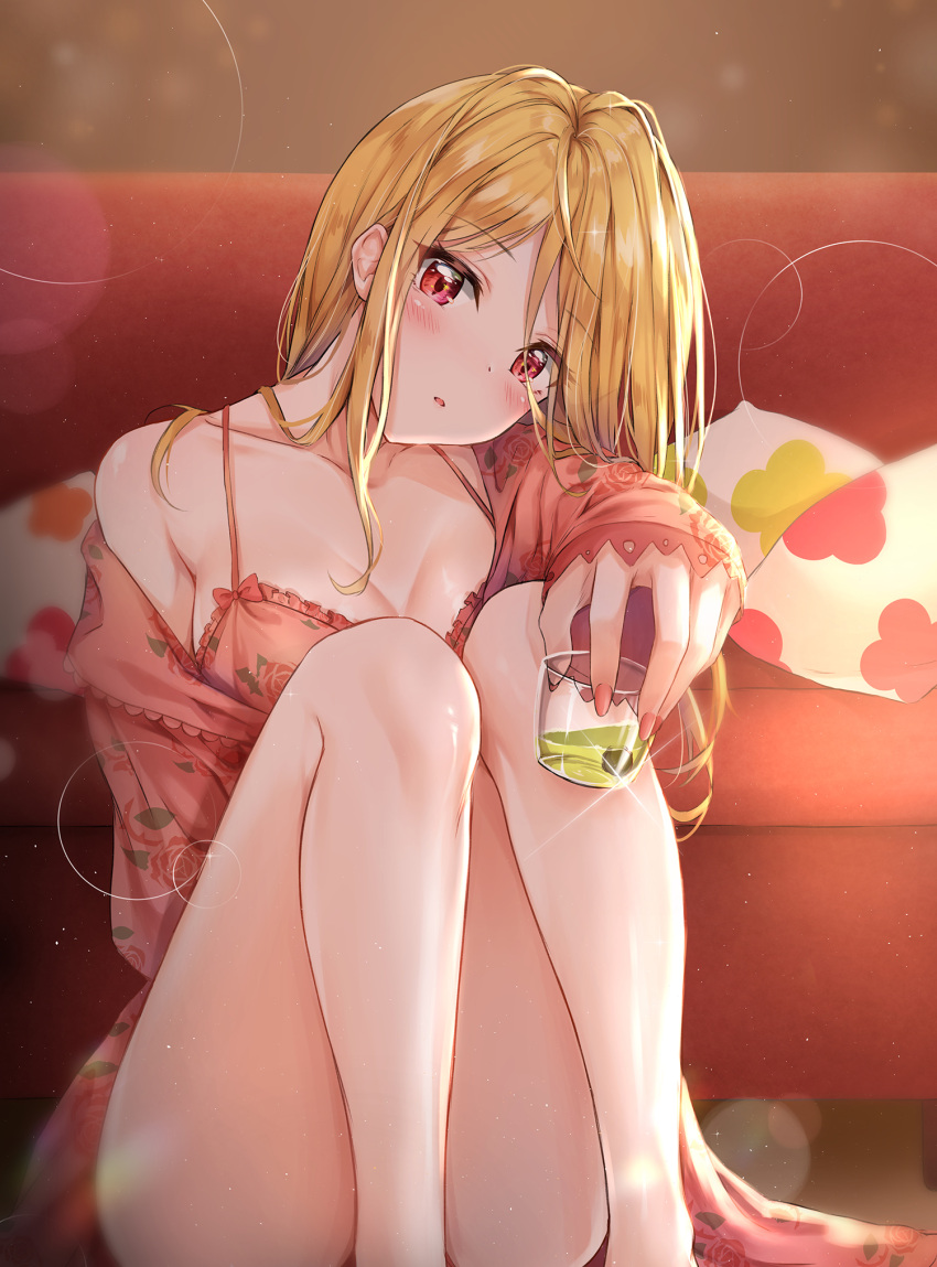 1girl ass bangs bare_legs bare_shoulders blonde_hair blurry blush bra breasts cleavage collarbone commentary_request convenient_leg couch cuna_(qunya) cup depth_of_field dress drink drinking_glass eyebrows_visible_through_hair floral_print frilled_bra frills glint head_tilt highres holding holding_cup idolmaster idolmaster_million_live! knees_up light_particles long_hair long_sleeves looking_at_viewer medium_breasts momose_rio nail_polish off_shoulder parted_lips pillow pink_bra pink_dress pink_nails red_eyes sidelocks sitting sleeves_past_wrists solo thighs underwear