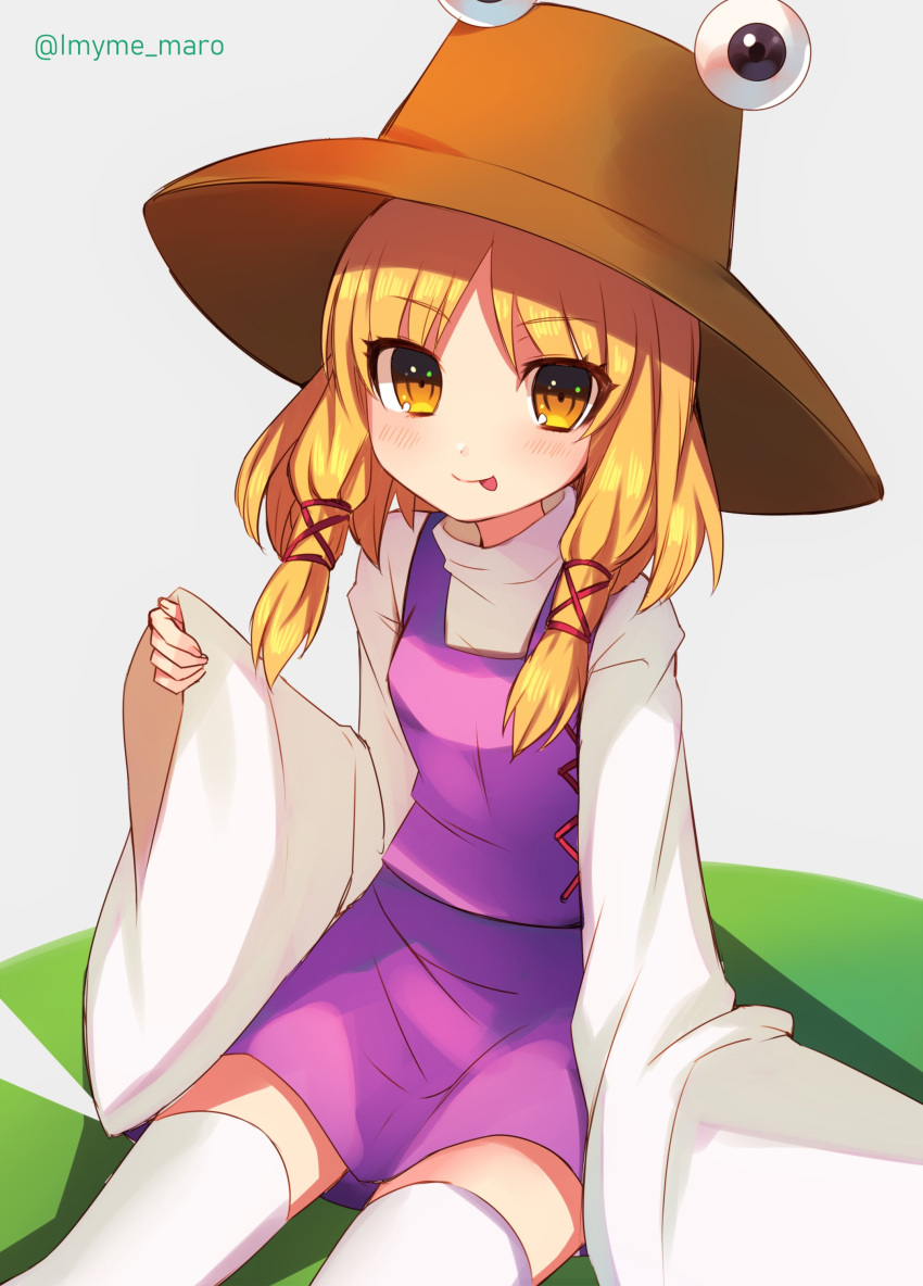 1girl :p absurdres blonde_hair blush eyebrows_visible_through_hair eyes grey_background hat highres long_sleeves looking_at_viewer marota moriya_suwako short_hair simple_background sitting sleeves_past_wrists solo thigh-highs tongue tongue_out touhou twitter_username white_legwear wide_sleeves yellow_eyes