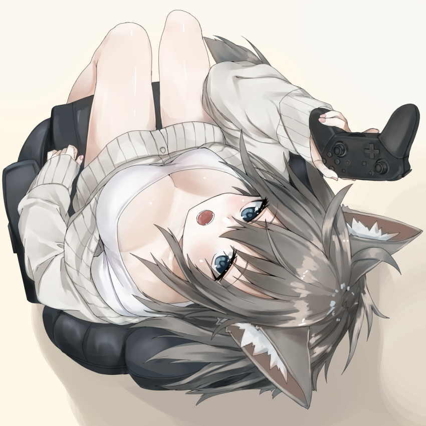 1girl animal_ear_fluff animal_ears armchair bangs blue_eyes breasts chair cleavage commentary_request controller eyebrows_visible_through_hair fingernails fox_ears fox_girl game_controller gamepad grey_background grey_hair grey_sweater hair_between_eyes highres holding large_breasts long_hair long_sleeves nail_polish naked_sweater open_mouth original pink_nails simple_background sitting solo sweater waichi