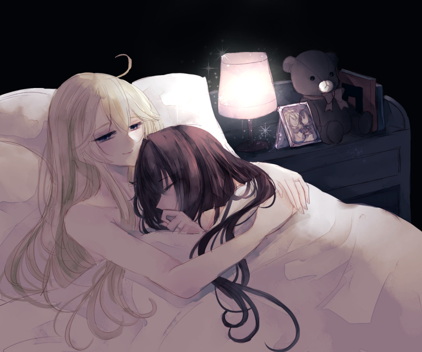 2girls bare_shoulders blanket blonde_hair book brown_hair closed_mouth commentary_request cuddling eyebrows_visible_through_hair hair_between_eyes highres iowa_(kantai_collection) jewelry kantai_collection long_hair multiple_girls photo pillow ring sleeping smile stuffed_animal stuffed_toy teddy_bear under_covers wedding_band wife_and_wife yamato_(kantai_collection) yuri