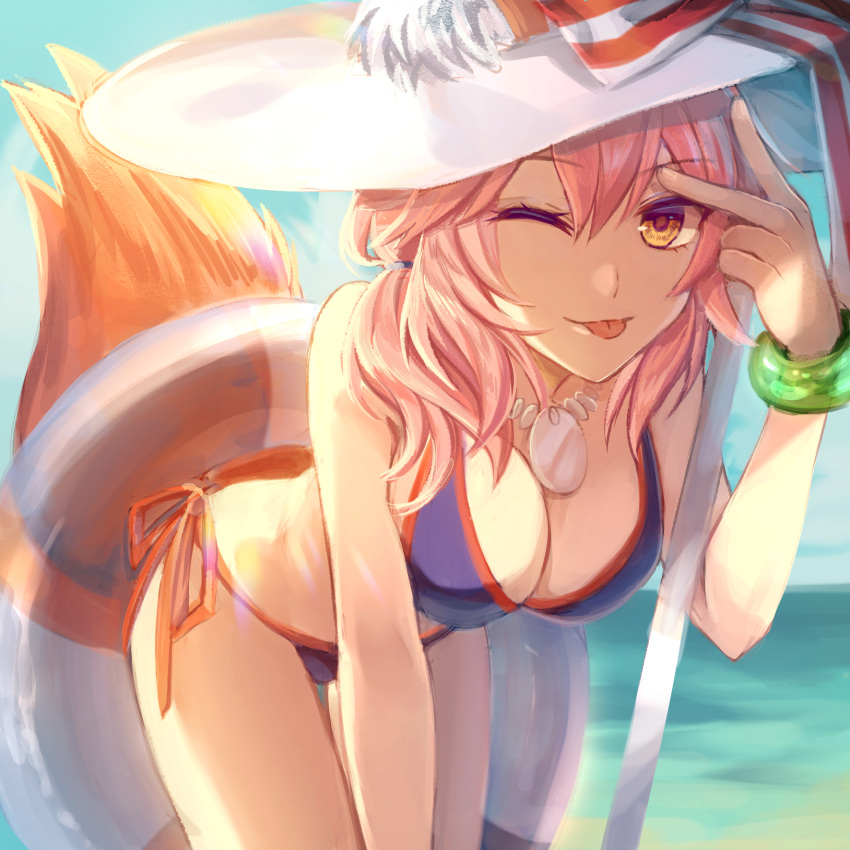 1girl ;p all_fours bikini blue_bikini blue_sky bow bracelet breasts cleavage day eyebrows_visible_through_hair fate/grand_order fate_(series) fox_tail hair_between_eyes hat hat_bow hat_ribbon highres innertube jewelry long_hair looking_at_viewer medium_breasts necklace ocean one_eye_closed orange_ribbon oranggila12 outdoors pink_hair ribbon side-tie_bikini sky solo striped striped_bow striped_ribbon sun_hat swimsuit tail tamamo_(fate)_(all) tamamo_no_mae_(swimsuit_lancer)_(fate) tongue tongue_out transparent white_hat yellow_eyes