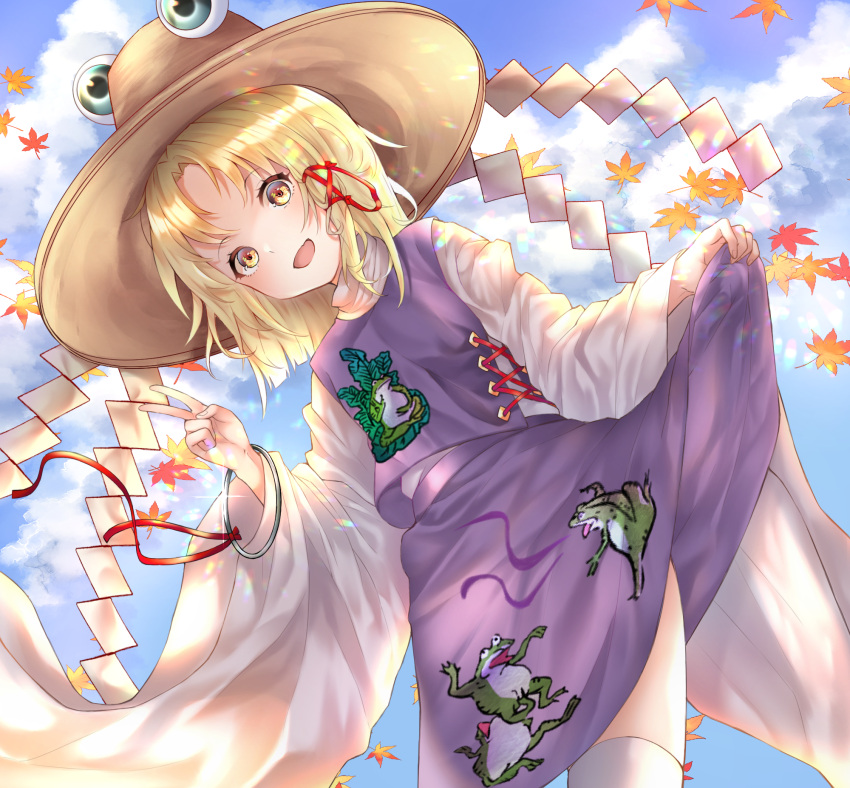 1girl animal_print autumn_leaves bangle blonde_hair blue_sky bracelet brown_hat clouds dutch_angle frog_print glint hair_ribbon hat highres jewelry long_hair long_sleeves looking_at_viewer moriya_suwako onikutonasu open_mouth outdoors purple_skirt purple_vest red_ribbon ribbon shide skirt skirt_hold sky smile solo touhou tress_ribbon turtleneck v vest white_legwear wide_sleeves yellow_eyes