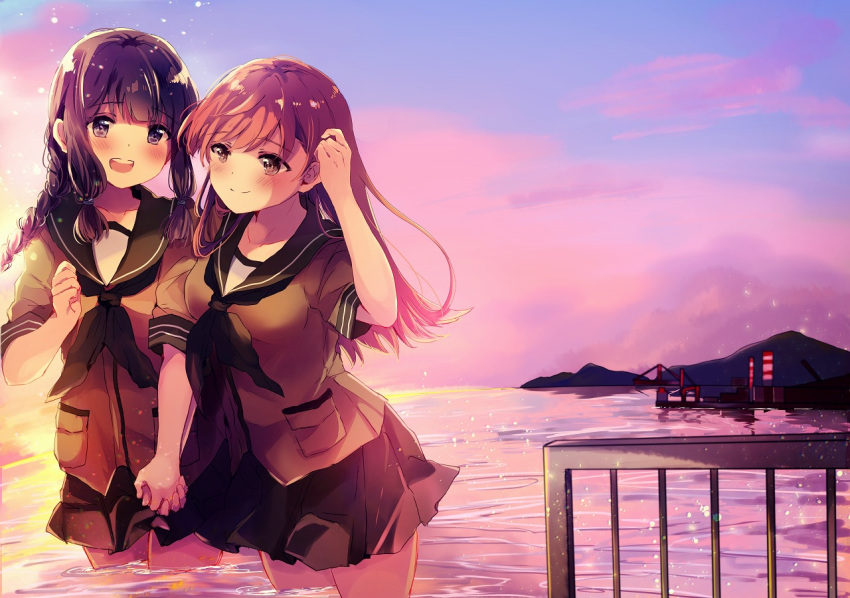 2girls :d bangs black_hair blunt_bangs braid brown_eyes brown_hair clenched_hand crane eyebrows_visible_through_hair green_neckwear green_serafuku green_skirt hair_braid hand_holding hand_in_hair kantai_collection kitakami_(kantai_collection) long_hair multiple_girls nanahamu neckerchief ocean ooi_(kantai_collection) open_mouth partially_submerged pleated_skirt school_uniform serafuku short_sleeves sidelocks single_braid skirt smile sunset