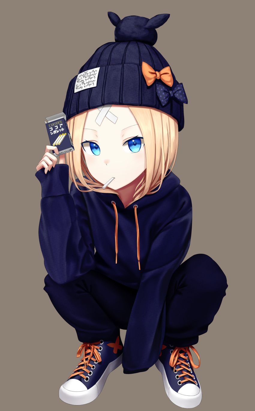 1girl abigail_williams_(fate/grand_order) absurdres bangs beanie black_bow black_hat blonde_hair blue_eyes blue_footwear blue_hoodie blue_pants blush bow brown_background cigarette_candy commentary_request crossed_bandaids drawstring fate/grand_order fate_(series) full_body hand_up hat hat_bow highres holding hood hood_down hoodie long_hair long_sleeves looking_at_viewer mouth_hold orange_bow pants parted_bangs print_bow sanbe_futoshi shoes simple_background sleeves_past_fingers sleeves_past_wrists sneakers solo spread_legs squatting star star_print translation_request