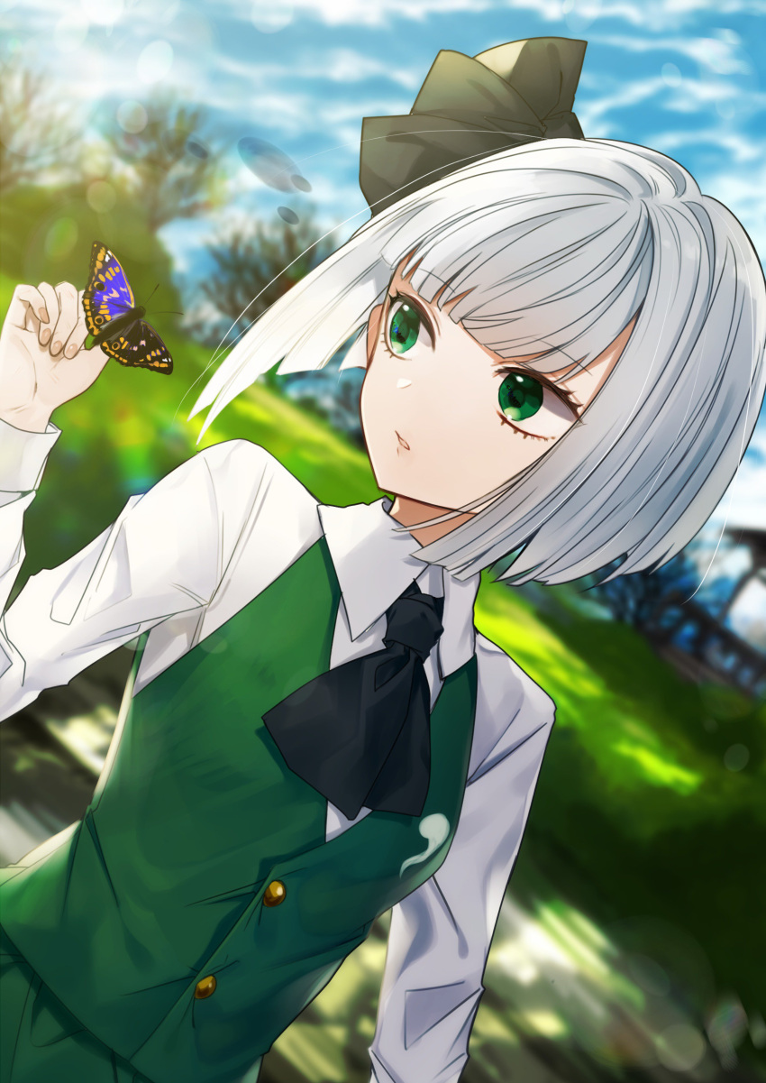 1girl absurdres ascot bangs black_neckwear black_ribbon blue_sky blurry blurry_background breasts bug butterfly commentary_request cowboy_shot daimaou_ruaeru day dutch_angle fingernails green_eyes green_skirt green_vest hair_ribbon highres insect konpaku_youmu long_sleeves medium_breasts outdoors parted_lips ribbon shirt short_hair silver_hair skirt skirt_set sky solo touhou tree vest white_shirt