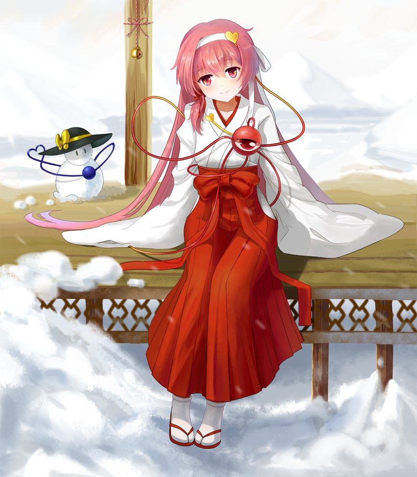 1girl alternate_costume alternate_hair_length alternate_hairstyle bell blurry chinese_commentary clouds collarbone commentary_request day depth_of_field hair_between_eyes hairband hakama_skirt head_tilt heart highres hip_vent japanese_clothes jingle_bell komeiji_koishi komeiji_satori long_hair looking_at_viewer miko mountain outdoors pin_(shikishin) pink_eyes pink_hair platform red_footwear revision sandals sidelocks single_sidelock sitting sky sleeves_past_fingers sleeves_past_wrists smile snow snowman solo string tabi third_eye touhou very_long_hair white_legwear