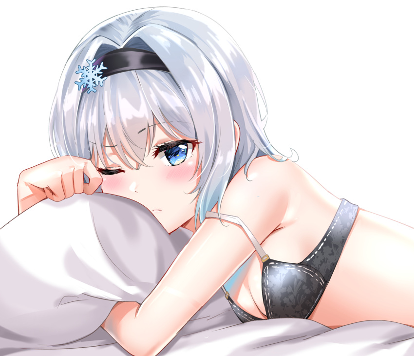 1girl bangs black_hairband blue_eyes blush bra closed_mouth eyebrows_visible_through_hair grey_bra hair_between_eyes hair_ornament hairband highres looking_at_viewer lying on_stomach one_eye_closed pillow ryuuou_no_oshigoto! short_hair silver_hair snowflake_hair_ornament solo sora_ginko strap_slip sunhyun underwear underwear_only