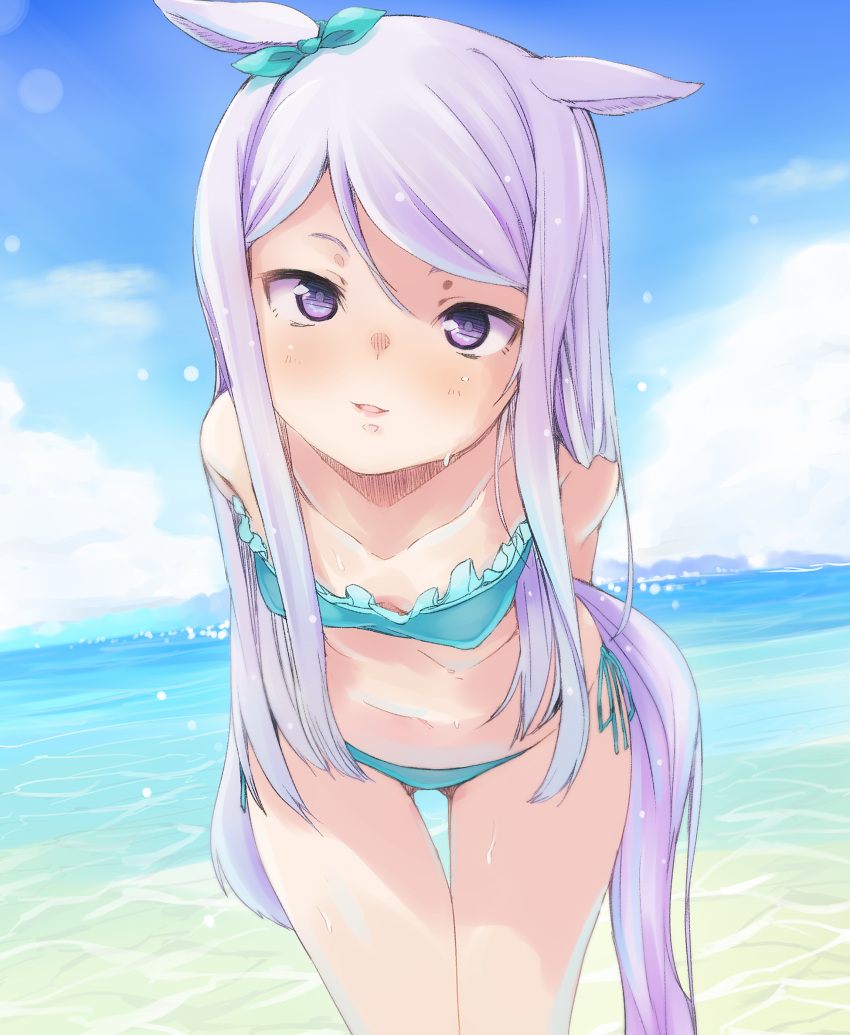 1girl absurdres animal_ears aqua_bikini arms_behind_back ass_visible_through_thighs bandeau beach bent_over bikini blush bow breasts cowboy_shot day dutch_angle hair_bow highres kogen lavender_eyes lavender_hair long_hair looking_at_viewer mejiro_mcqueen navel outdoors parted_lips side-tie_bikini sidelocks small_breasts smile solo swimsuit tail thigh_gap umamusume wet