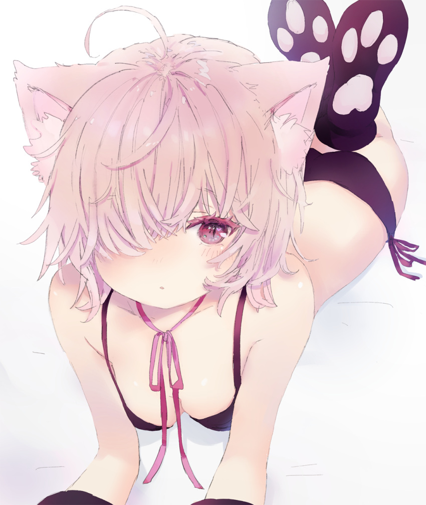 1girl ahoge animal_ear_fluff animal_ears bangs bare_shoulders black_bra black_legwear black_panties blush bra breasts cat_ears collarbone commentary english_commentary hair_over_one_eye highres kneehighs legs_up lying neck_ribbon no_shoes on_stomach original panties parted_lips pink_hair pink_ribbon red_eyes ribbon sha2mo side-tie_panties small_breasts soles solo underwear