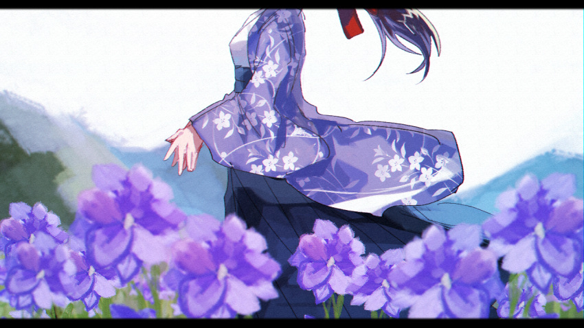 1girl black_hakama bow brown_hair danjou_sora day field floral_print flower flower_field from_side hair_bow hakama head_out_of_frame japanese_clothes kimono letterboxed long_hair long_sleeves mountain original outdoors own_hands_together purple_flower red_bow solo white_kimono wide_sleeves