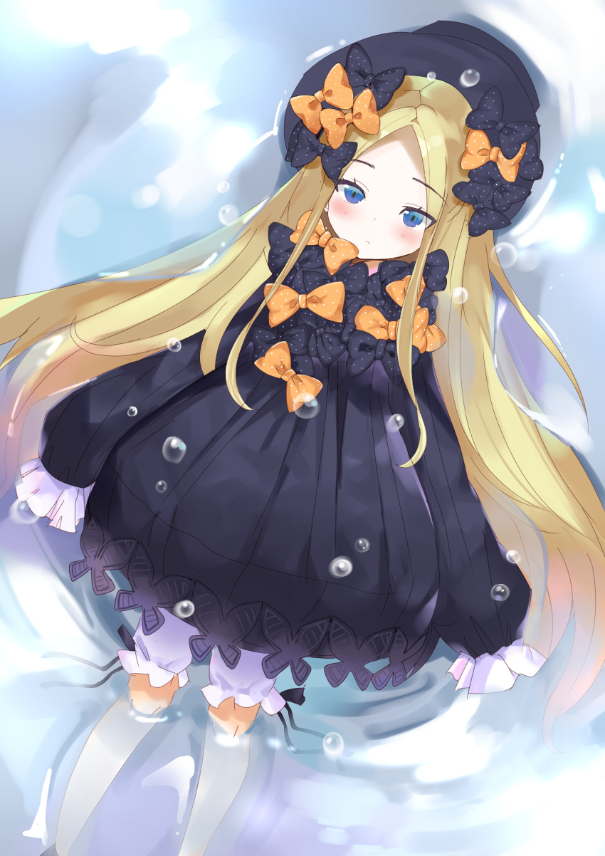 1girl abigail_williams_(fate/grand_order) absurdres bangs black_bow black_dress black_hat blonde_hair bloomers blue_eyes blush bow closed_mouth commentary dress dutch_angle english_commentary eyebrows_visible_through_hair fate/grand_order fate_(series) forehead hair_bow hat highres light_frown long_hair long_sleeves looking_at_viewer lying on_back orange_bow parted_bangs polka_dot polka_dot_bow satori_(pixiv) sleeves_past_fingers sleeves_past_wrists solo underwear very_long_hair water white_bloomers