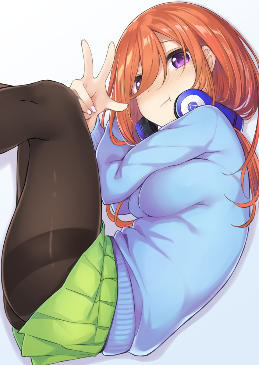 1girl ass bangs black_legwear blue_sweater blush breasts cardigan closed_mouth eyebrows_visible_through_hair folded go-toubun_no_hanayome green_skirt hair_between_eyes headphones headphones_around_neck highres large_breasts long_hair long_sleeves looking_at_viewer lying miniskirt nakano_miku nose_blush on_side pantyhose pleated_skirt pout redhead shirt skirt solo sweater tetora_(yumejihuka) thighband_pantyhose violet_eyes white_shirt