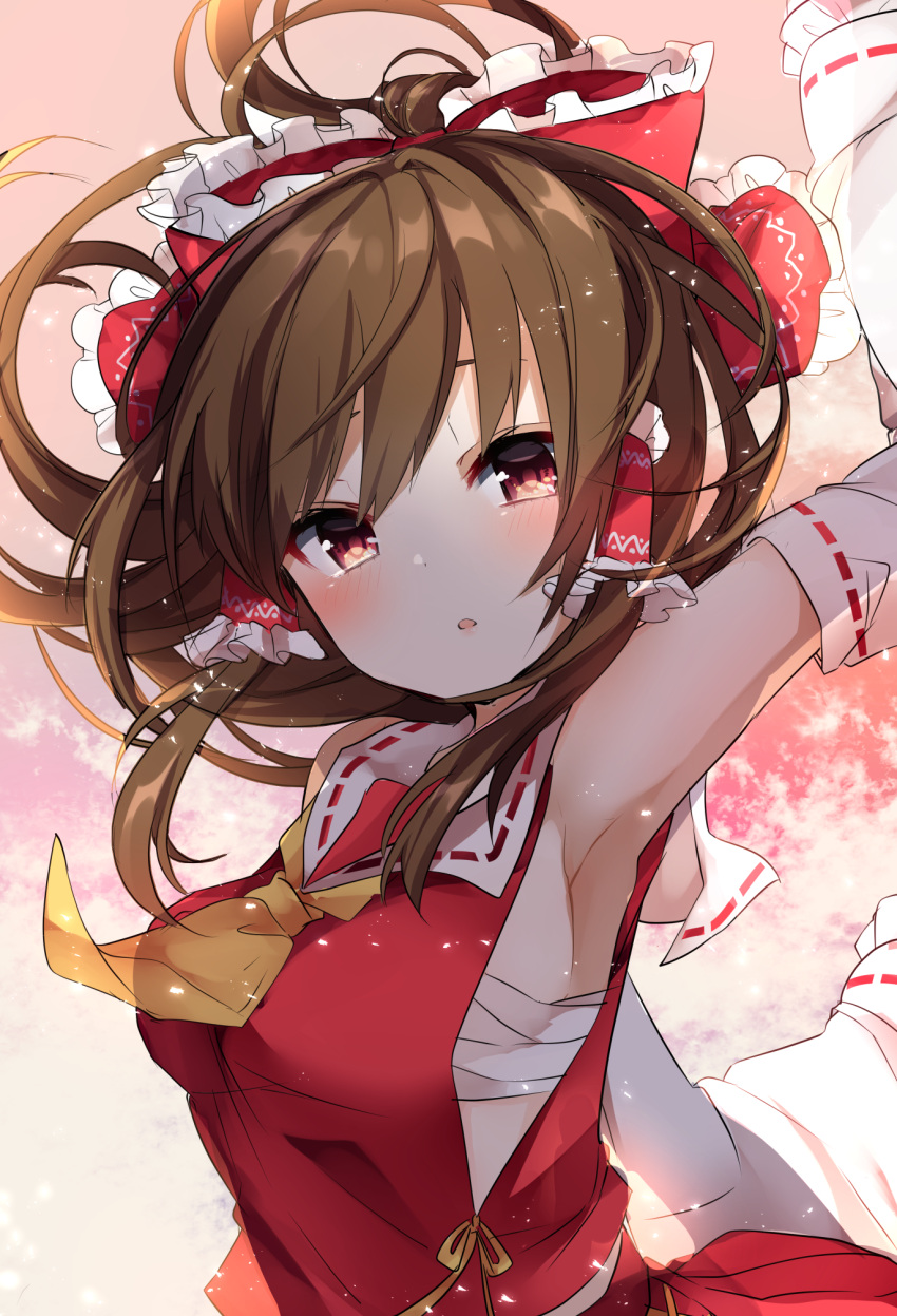 1girl arm_up armpits ascot bare_shoulders blush bow breasts brown_hair commentary_request detached_sleeves frilled_bow frills gradient gradient_background hair_bow hair_tubes hakurei_reimu highres karasusou_nano light_particles long_hair long_sleeves looking_at_viewer medium_breasts parted_lips pink_background red_bow red_eyes red_skirt ribbon-trimmed_sleeves ribbon_trim sarashi sidelocks skirt skirt_set solo touhou upper_body wide_sleeves yellow_neckwear