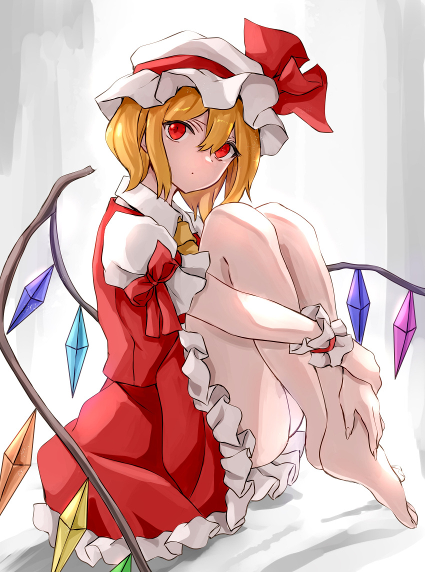 1girl absurdres arm_ribbon ascot ass bangs bare_legs barefoot blonde_hair commentary_request crystal flandre_scarlet full_body grey_background hair_between_eyes hat hat_ribbon highres jan_(lightdragoon) knees_up looking_at_viewer mob_cap petticoat puffy_short_sleeves puffy_sleeves red_eyes red_ribbon red_skirt red_vest ribbon shadow shirt short_hair short_sleeves sitting skirt skirt_set solo thighs touhou vest white_hat white_shirt wing_collar wings wrist_cuffs yellow_neckwear