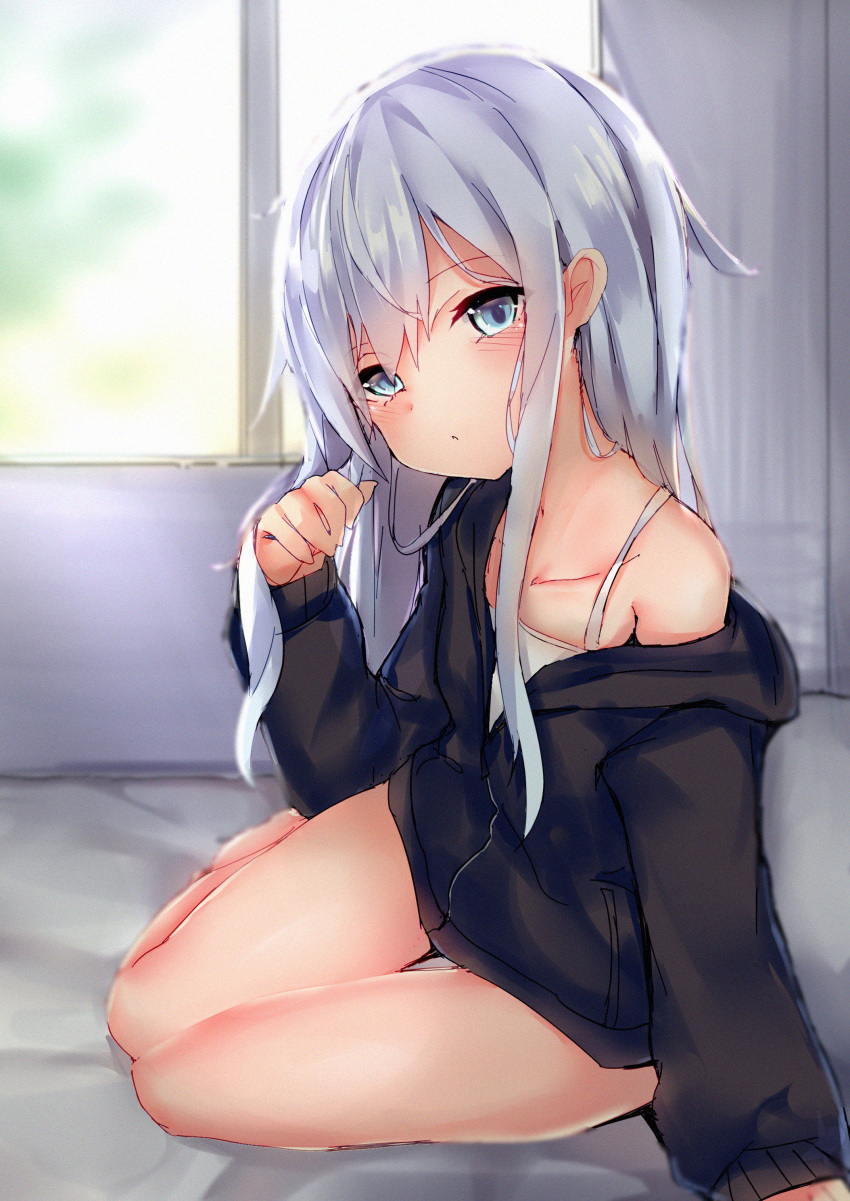 absurdres arm_support bare_shoulders black_sweater blue_eyes blush collarbone commentary day hibiki_(kantai_collection) highres indoors kantai_collection kure_(kure_ng) long_hair looking_at_viewer off-shoulder_sweater off_shoulder on_bed pillow sidelocks silver_hair sitting sleeves_past_wrists sweater very_long_hair white_tank_top window