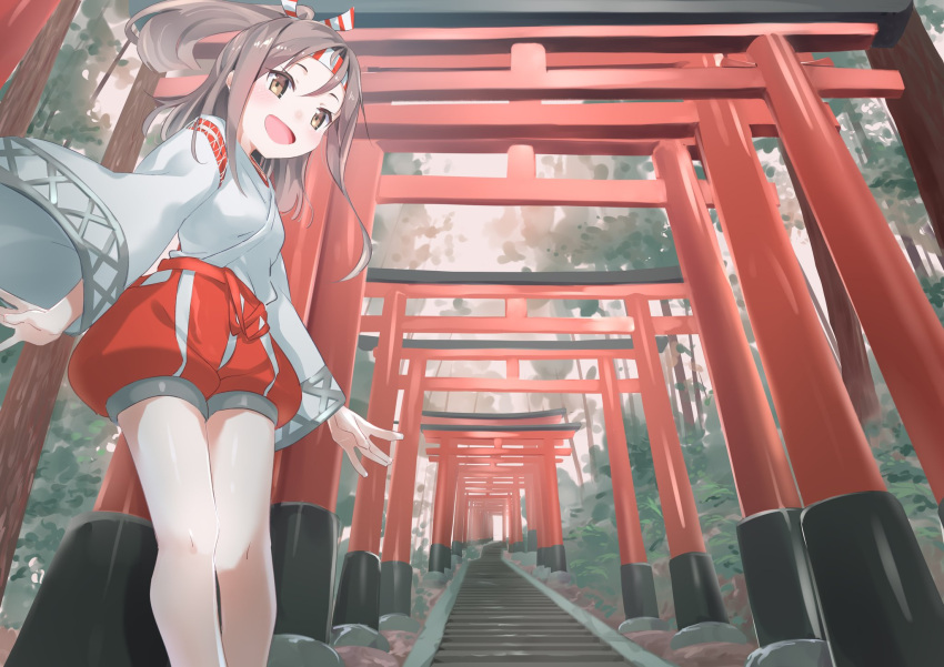 1girl :d blush breasts brown_eyes brown_hair feet_out_of_frame from_below gedoo_(gedo) hachimaki headband high_ponytail highres japanese_clothes kantai_collection long_hair looking_at_viewer open_mouth outdoors small_breasts smile solo striped_headband torii wide_sleeves zuihou_(kantai_collection)