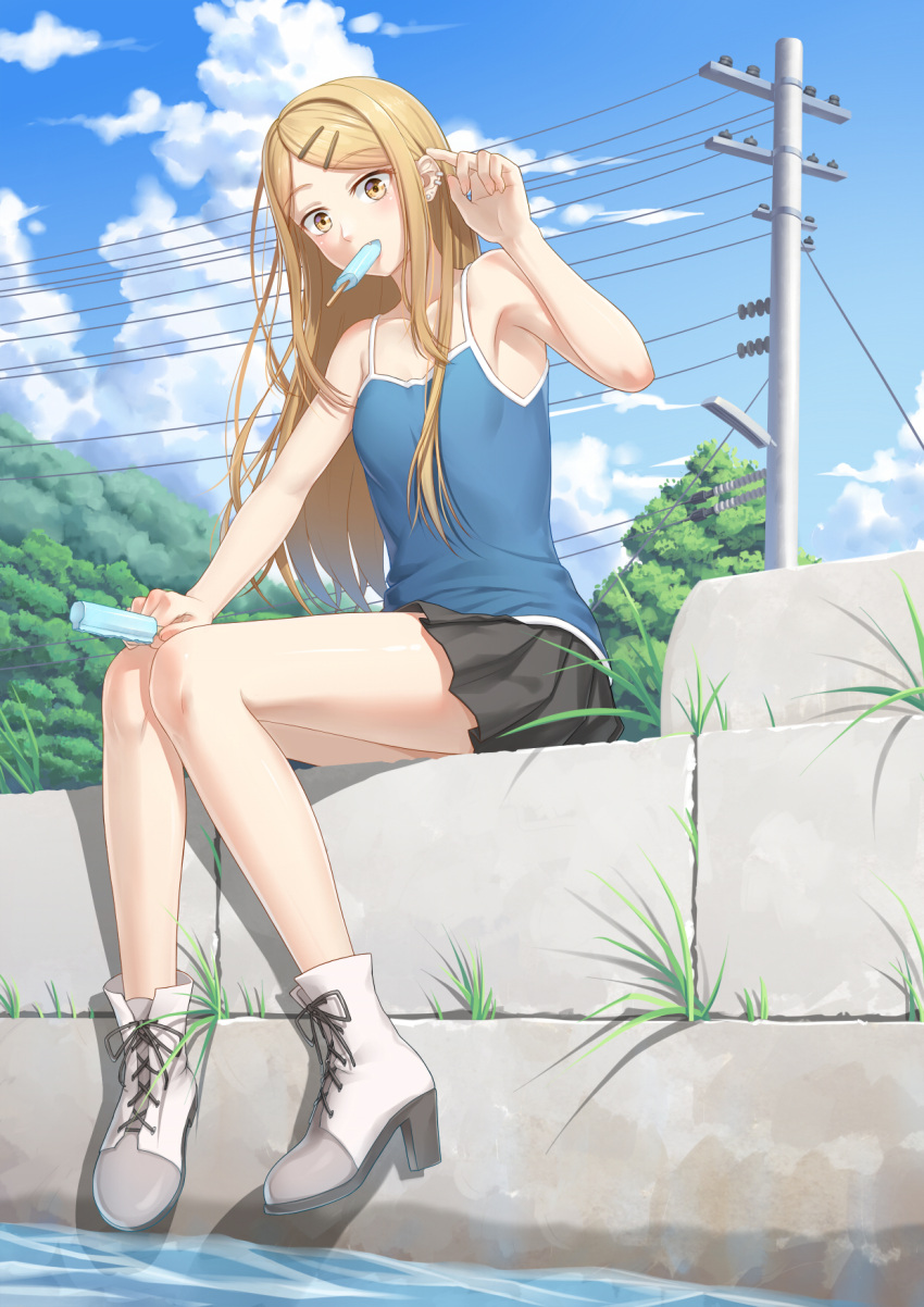 1girl anarchojs bare_legs blonde_hair camisole clouds dagashi_kashi ear_piercing endou_saya food full_body hair_ornament hairclip highres long_hair looking_at_viewer mouth_hold outdoors piercing pleated_skirt popsicle sitting skirt sky solo tree water yellow_eyes