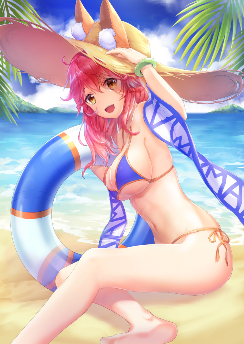 1girl :d animal_ear_fluff animal_ears arm_up bangs bare_arms bare_legs bare_shoulders barefoot beach bikini blue_bikini blue_sky bracelet breasts brown_eyes brown_hat clouds cloudy_sky commentary_request day ears_through_headwear eyebrows_visible_through_hair fate/grand_order fate_(series) fox_ears hair_between_eyes hand_on_headwear hat highres horizon innertube jewelry large_breasts long_hair looking_at_viewer lunacle navel no_tail ocean open_mouth outdoors palm_tree redhead sand shadow shawl side-tie_bikini sky smile solo stomach straw_hat swimsuit tamamo_(fate)_(all) tamamo_no_mae_(swimsuit_lancer)_(fate) transparent tree water