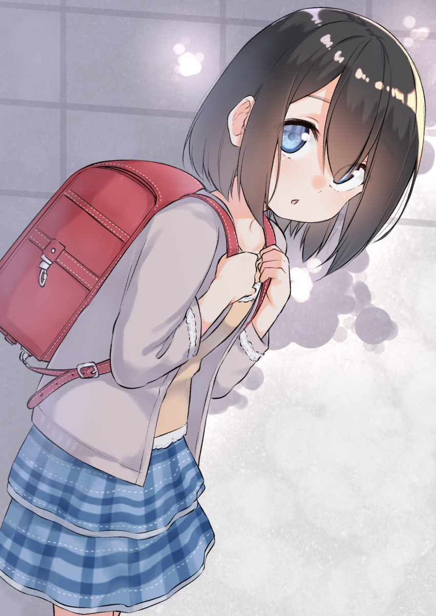 1girl backpack bag bangs blue_eyes blue_skirt blush brown_hair brown_jacket brown_shirt chestnut_mouth collarbone commentary_request eyebrows_visible_through_hair hair_between_eyes hands_up highres holding jacket layered_skirt leaning_forward long_sleeves looking_at_viewer looking_to_the_side open_clothes open_jacket original parted_lips plaid plaid_skirt randoseru shirt skirt solo suzunari_shizuku younger yuki_arare