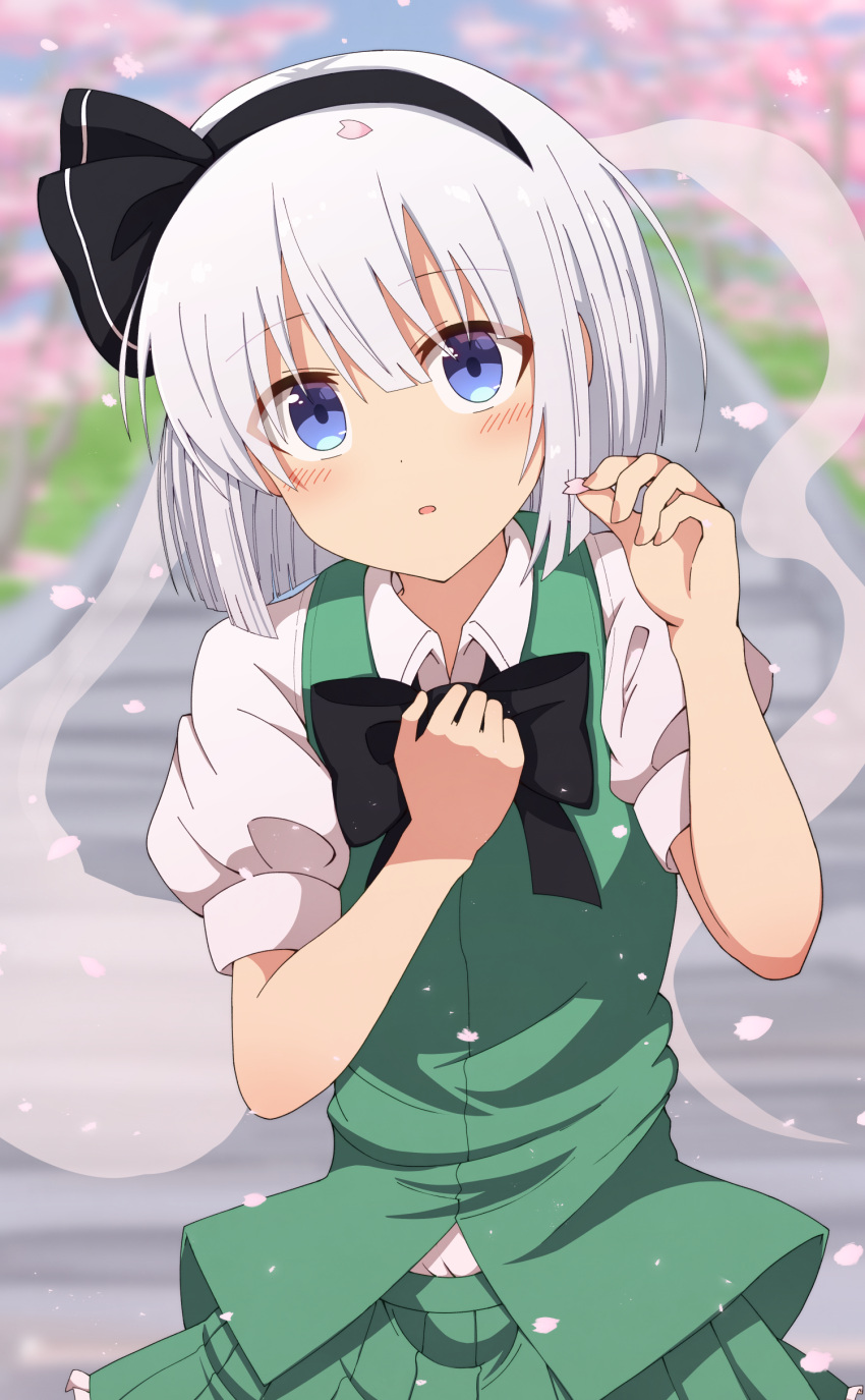 1girl absurdres arms_up bangs black_neckwear blue_eyes blurry blush bow bowtie cherry_blossoms day depth_of_field eyebrows_visible_through_hair green_skirt green_vest hair_between_eyes hair_ribbon hand_on_own_chest head_tilt highres holding_petal konpaku_youmu konpaku_youmu_(ghost) leaning_over looking_at_viewer outdoors parted_lips petals puffy_short_sleeves puffy_sleeves ribbon shirt short_hair short_sleeves silver_hair skirt sleeve_cuffs solo stairs standing taki_sandstone touhou upper_body vest white_shirt