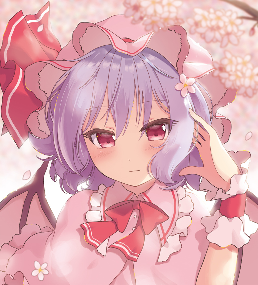 1girl bangs bat_wings beni_kurage blue_hair blush bow bowtie cherry_blossoms commentary_request dress eyebrows_visible_through_hair flower frilled_shirt_collar frills hair_between_eyes hair_flower hair_ornament hand_in_hair hand_up hat hat_ribbon highres light_smile looking_at_viewer mob_cap petals pink_background pink_capelet pink_dress pink_flower pink_headwear red_bow red_eyes red_neckwear red_ribbon remilia_scarlet ribbon short_hair solo touhou upper_body wings wrist_cuffs
