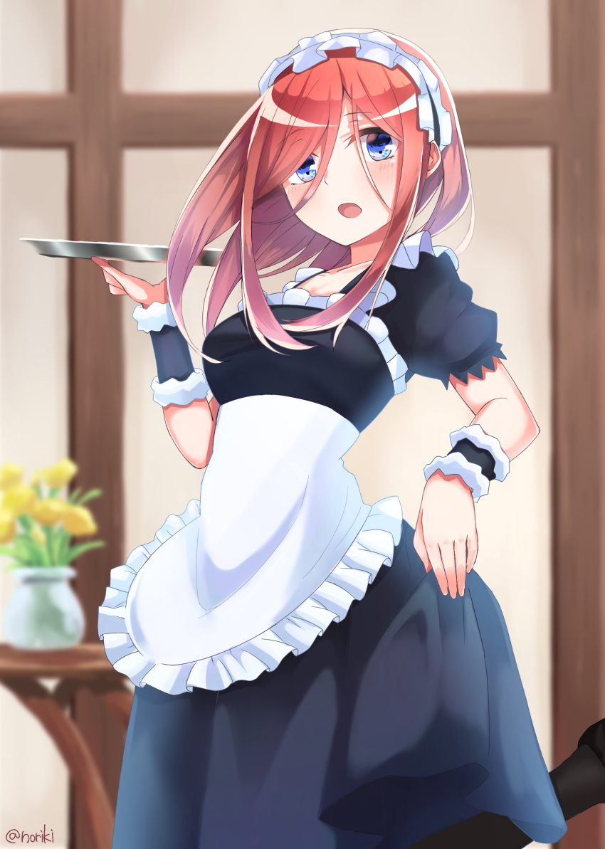 1girl absurdres alternate_costume apron bangs black_footwear black_hairband black_legwear blue_dress blue_eyes blurry blurry_background blush breasts brown_hair commentary_request depth_of_field dress enmaided eyebrows_visible_through_hair frilled_apron frilled_hairband frills go-toubun_no_hanayome hair_between_eyes hairband hand_up highres holding holding_tray honorikiti long_hair maid nakano_miku open_mouth pantyhose puffy_short_sleeves puffy_sleeves shoes short_sleeves small_breasts solo standing standing_on_one_leg transparent tray twitter_username vase white_apron wrist_cuffs