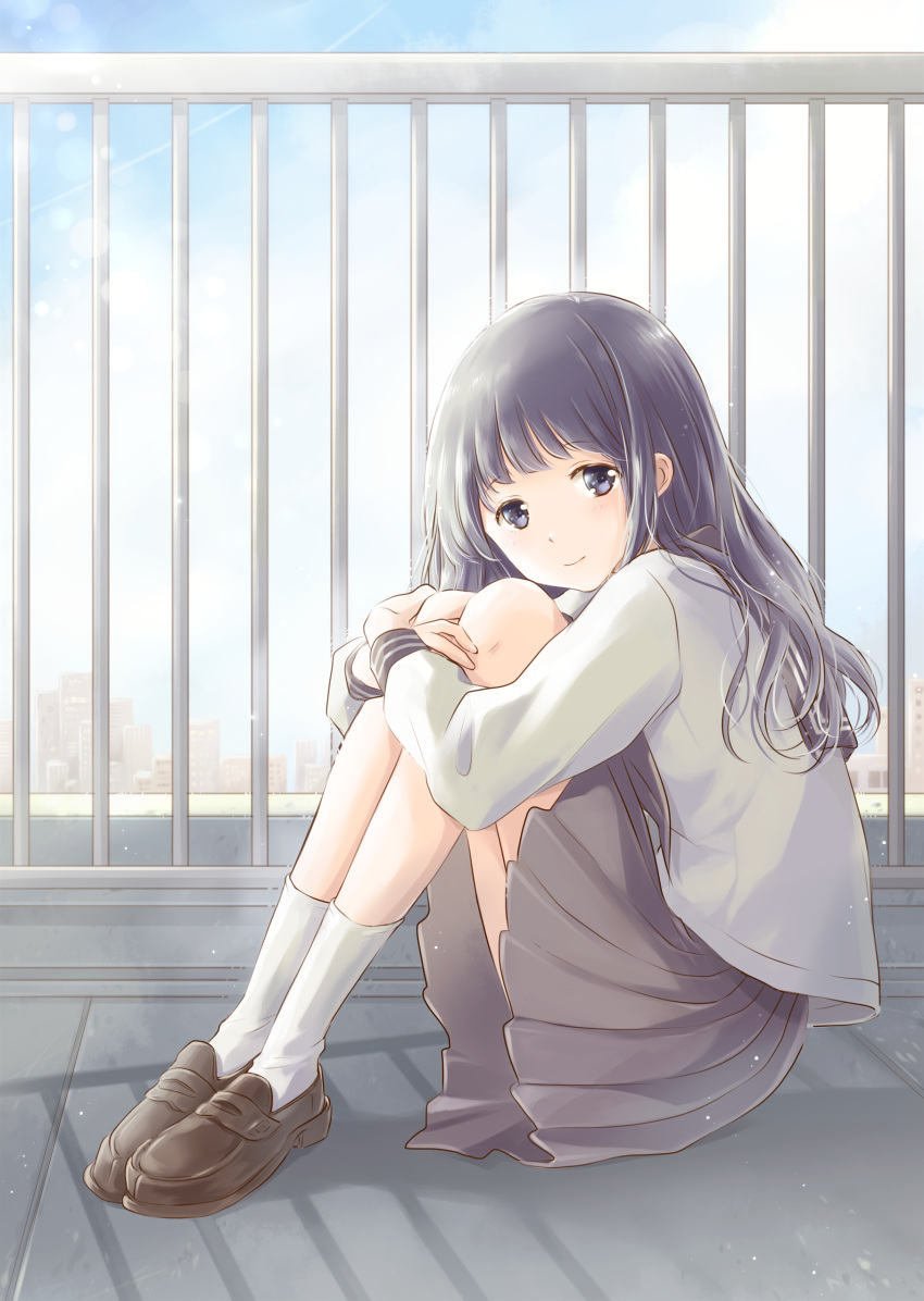 1girl absurdres black_hair black_sailor_collar blue_eyes blue_sky blurry brown_footwear brown_skirt cityscape clouds commentary_request day depth_of_field from_side head_tilt highres hoshiibara_mato knees_to_chest leg_hug legs_together light_particles loafers long_hair long_sleeves looking_at_viewer original outdoors pleated_skirt railing rooftop sailor_collar school_uniform serafuku shadow shoes sitting skirt sky sleeve_cuffs smile solo white_legwear