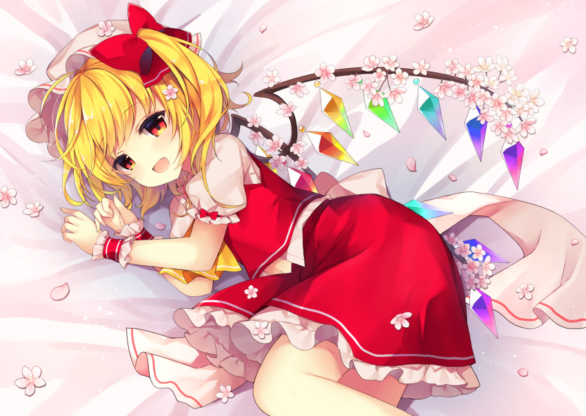 1girl :d ascot bangs bed_sheet blonde_hair blush bow cherry_blossoms commentary_request crystal eyebrows_visible_through_hair fang feet_out_of_frame flandre_scarlet hands_up hat hat_bow highres looking_at_viewer lying mob_cap on_side one_side_up open_mouth petals petticoat puffy_short_sleeves puffy_sleeves red_bow red_eyes red_skirt red_vest ruhika shirt short_hair short_sleeves skirt skirt_set smile solo touhou vest white_headwear white_shirt wings wrist_cuffs yellow_neckwear