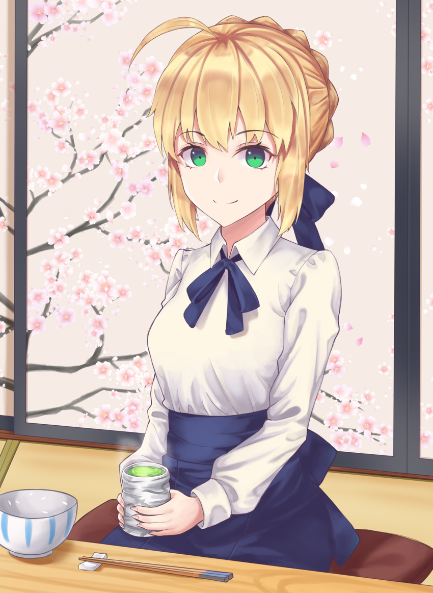 1girl ahoge artoria_pendragon_(all) blonde_hair blue_ribbon blue_skirt braided_bun chopsticks collared_shirt cup fate/stay_night fate_(series) green_eyes hair_ribbon highres holding holding_cup indoors looking_at_viewer neck_ribbon ribbon saber shirt short_hair sitting skirt smile solo tea user_wye9686 white_shirt wing_collar