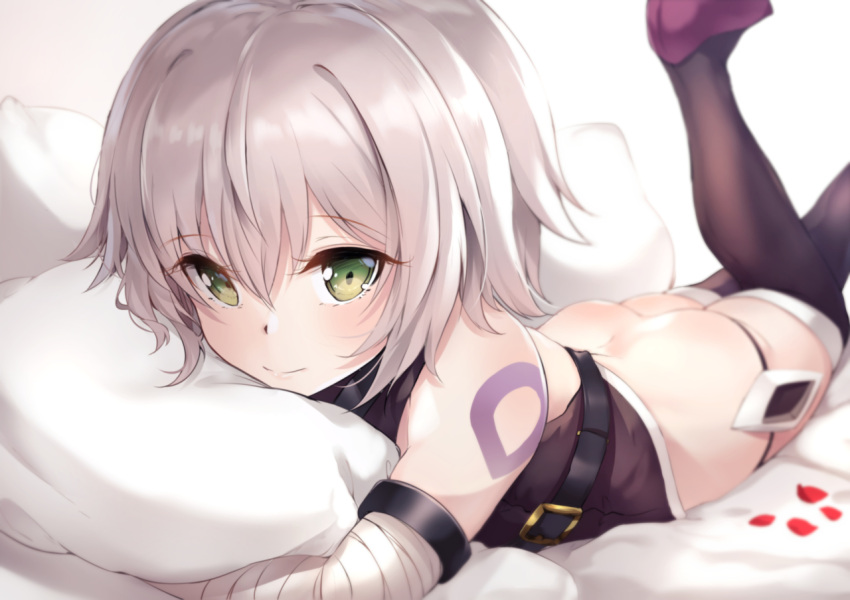 1girl ass bandaged_arm bandages bangs bare_shoulders bed_sheet black_footwear black_legwear black_panties black_shirt blurry blurry_background boots closed_mouth commentary depth_of_field eyebrows_visible_through_hair fate/apocrypha fate/grand_order fate_(series) green_eyes grey_hair hair_between_eyes jack_the_ripper_(fate/apocrypha) legs_up looking_at_viewer lowleg lowleg_panties lying nakatokung on_stomach panties petals pillow pillow_hug shirt shoulder_tattoo sleeveless sleeveless_shirt smile solo tattoo thigh-highs thigh_boots underwear