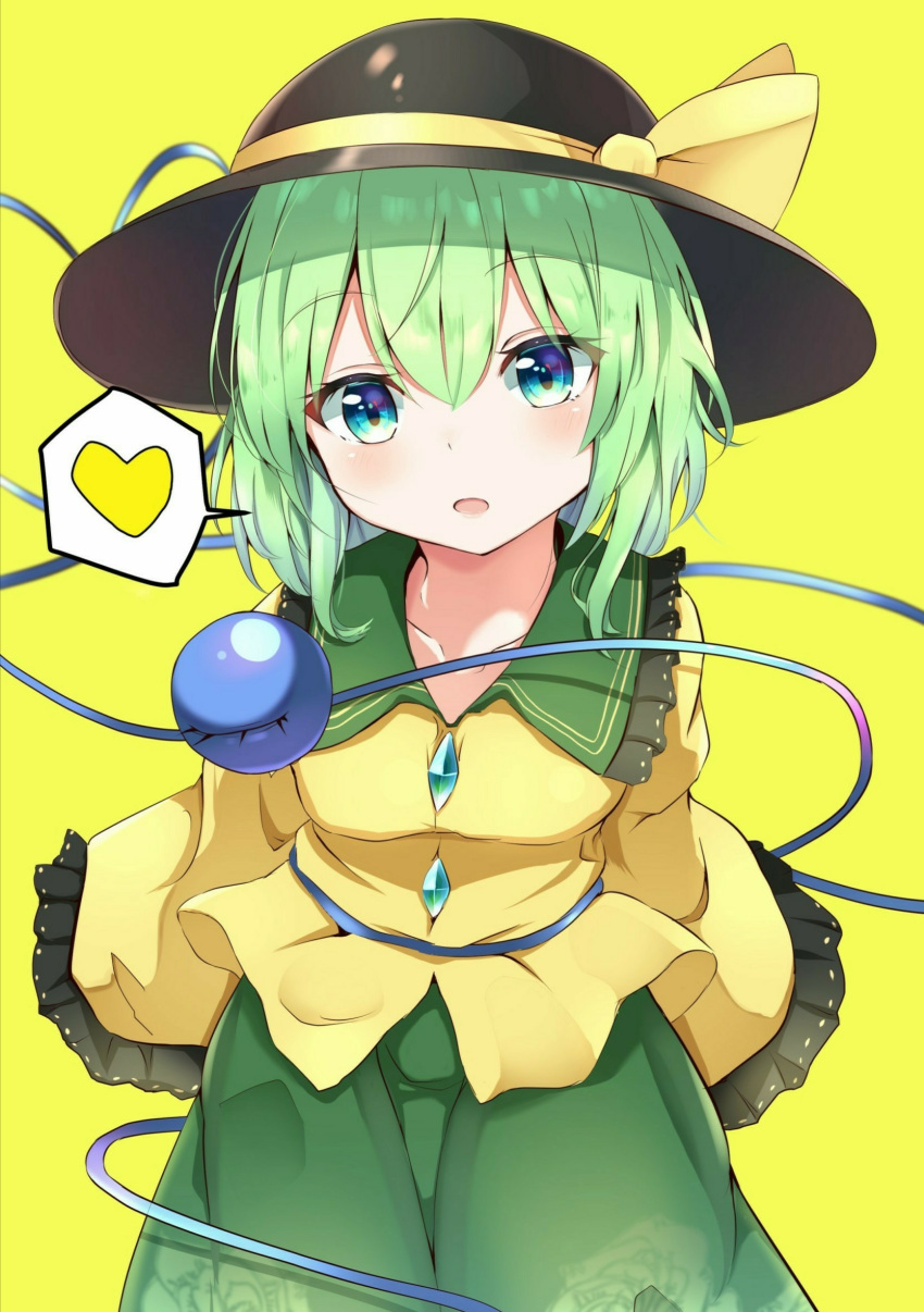 1girl arms_behind_back black_headwear blue_eyes blush collarbone cowboy_shot eyebrows_visible_through_hair floral_print frilled_shirt_collar frilled_sleeves frills green_hair green_skirt hair_between_eyes hat hat_ribbon head_tilt heart highres iyo_(ya_na_kanji) komeiji_koishi leaning_forward looking_at_viewer open_mouth ribbon rose_print shirt short_hair simple_background skirt sleeves_past_fingers sleeves_past_wrists solo speech_bubble spoken_heart standing third_eye touhou yellow_background yellow_shirt