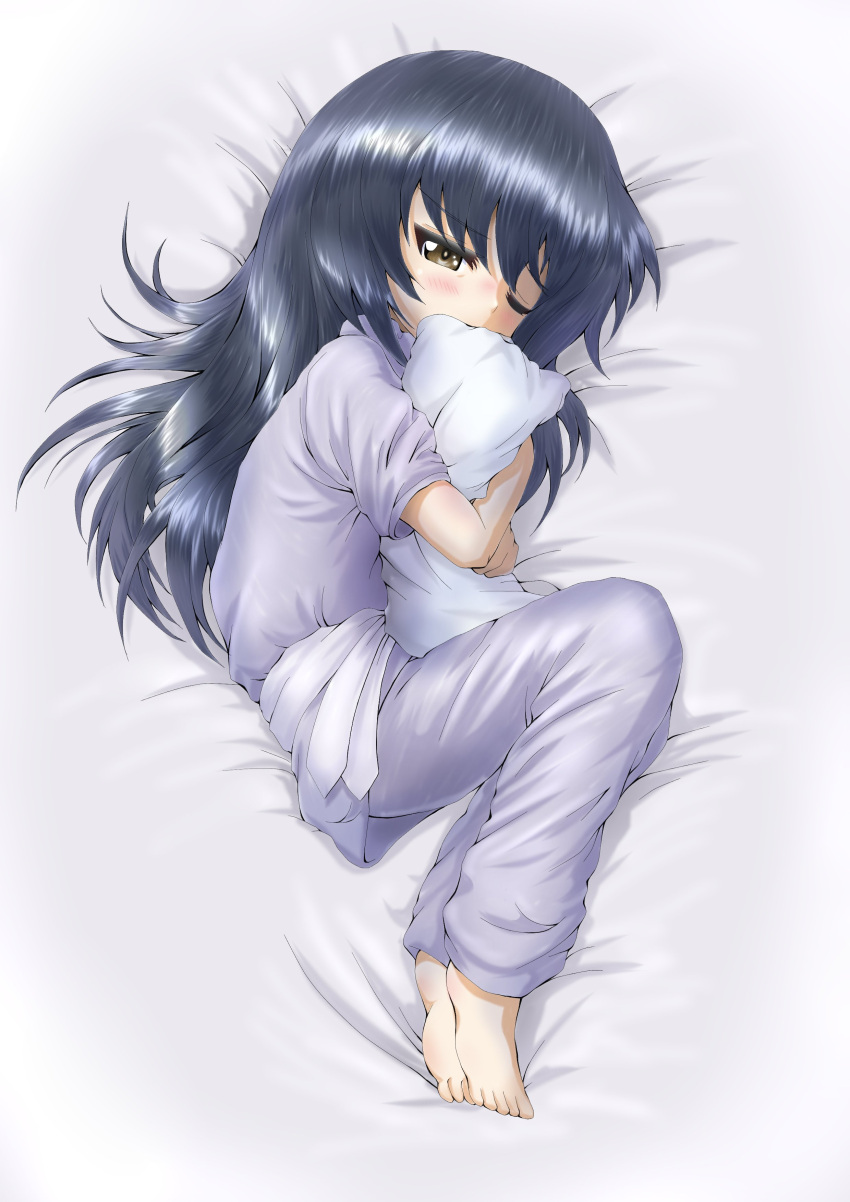 1girl absurdres bangs barefoot bed_sheet black_hair blue_pants blue_shirt brown_eyes commentary daxz240r eyebrows_visible_through_hair fetal_position from_above full_body girls_und_panzer half-closed_eye hat highres long_hair lying messy_hair on_bed on_side one_eye_closed pajamas pants pillow_hat reizei_mako shirt short_sleeves sleeping solo