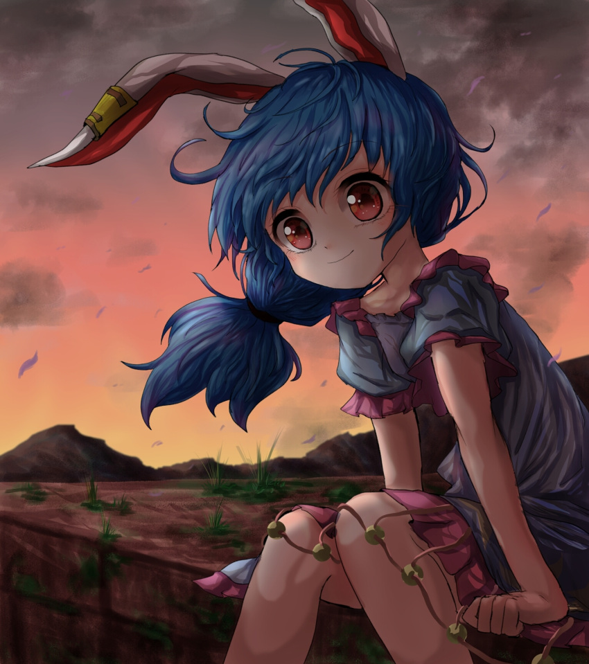 1girl animal_ears blue_dress brick_wall clouds cloudy_sky commentary_request dress ear_clip eyebrows_visible_through_hair feet_out_of_frame grass hair_blowing highres kayon_(touzoku) knees_together layered_dress leaning_forward long_hair looking_at_viewer low-tied_long_hair mountain pink_skirt puffy_short_sleeves puffy_sleeves rabbit_ears red_eyes red_sky seiran_(touhou) short_sleeves sitting skirt sky smile solo sunset touhou twilight wind