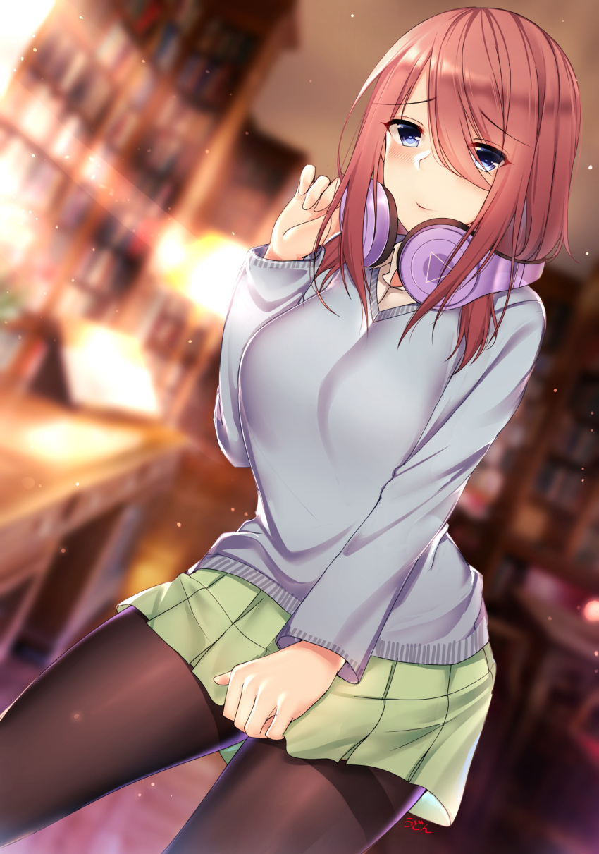 1girl black_legwear blue_eyes blurry blurry_background blush bookshelf breasts day dutch_angle go-toubun_no_hanayome green_skirt grey_sweater hair_between_eyes hand_up headphones headphones_around_neck highres indoors large_breasts long_hair nakano_miku pantyhose qqq school_uniform skirt skirt_hold solo standing sunlight sweater table thighband_pantyhose