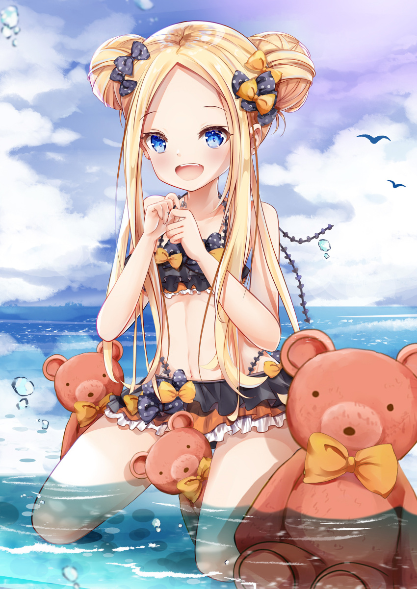 1girl :d abigail_williams_(fate/grand_order) bangs bare_arms bare_shoulders bikini black_bikini black_bow blonde_hair blue_eyes blue_sky blush bow clouds cloudy_sky collarbone day double_bun emerald_float eyebrows_visible_through_hair fang fate/grand_order fate_(series) forehead full_body hair_bow hands_up highres holding holding_key horizon key kneeling long_hair looking_at_viewer mutang ocean open_mouth orange_bow outdoors parted_bangs polka_dot polka_dot_bow sidelocks sky smile solo stuffed_animal stuffed_toy swimsuit teddy_bear very_long_hair water