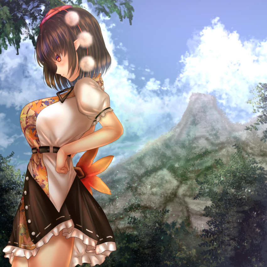 1girl arched_back belt black_hair black_skirt blue_sky breasts clenched_hand clouds commentary_request cowboy_shot day fan feather_fan forest from_side hands_on_hips hat highres holding holding_fan large_breasts leaf_print light_particles light_smile looking_down looking_to_the_side mountain nature outdoors petticoat pointy_ears pom_pom_(clothes) profile puffy_short_sleeves puffy_sleeves red_eyes shameimaru_aya shirt short_hair short_sleeves shounen_(hogehoge) skirt sky solo standing tokin_hat touhou tree untucked_shirt white_shirt youkai_mountain