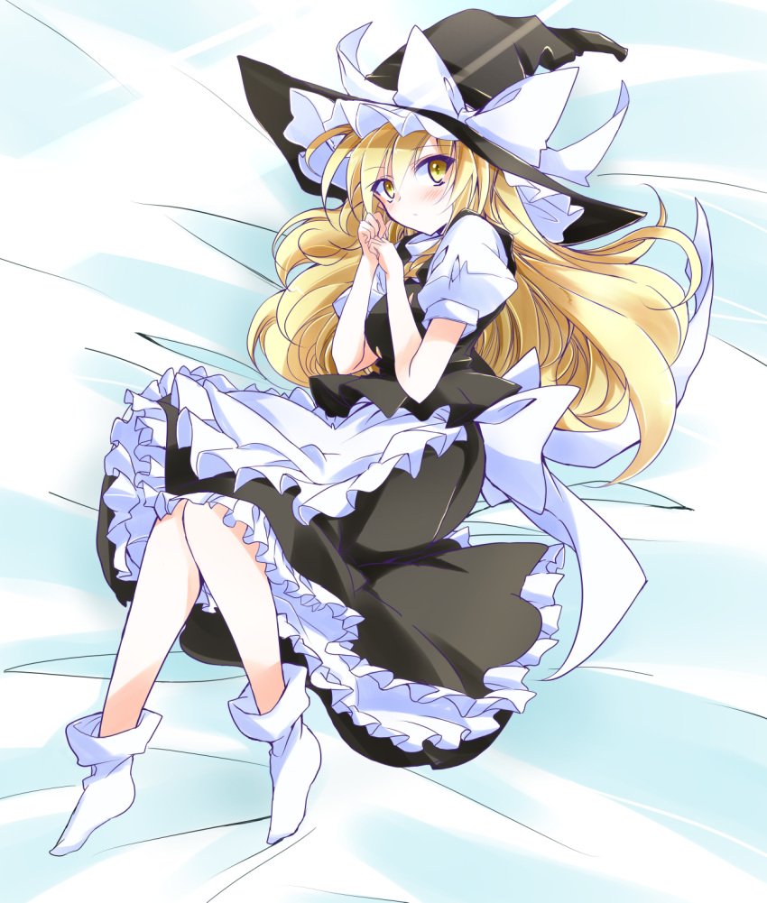 1girl apron black_headwear black_skirt blonde_hair blush eyebrows_visible_through_hair full_body hair_between_eyes hat highres ichimura_kanata kirisame_marisa long_hair long_skirt looking_at_viewer lying on_side short_sleeves skirt socks solo touhou very_long_hair waist_apron white_apron white_legwear witch_hat yellow_eyes