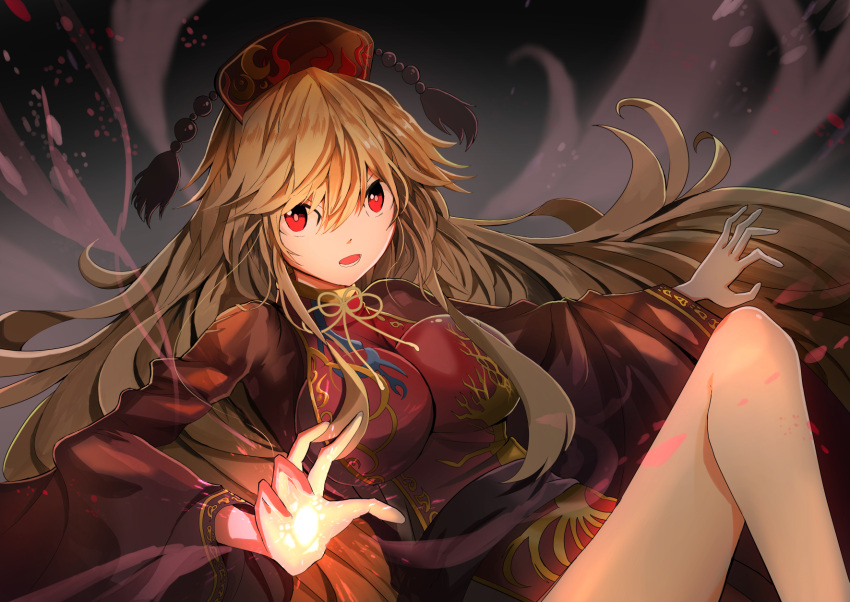 1girl black_dress blonde_hair breasts commentary_request dress energy folded_leg glowing glowing_hand gradient gradient_background grey_background hair_between_eyes hat highres junko_(touhou) knee_up large_breasts long_hair long_sleeves looking_at_viewer lower_teeth lying ooru_(t20nozomu) open_hand open_mouth outstretched_arm reclining red_eyes solo tabard touhou very_long_hair