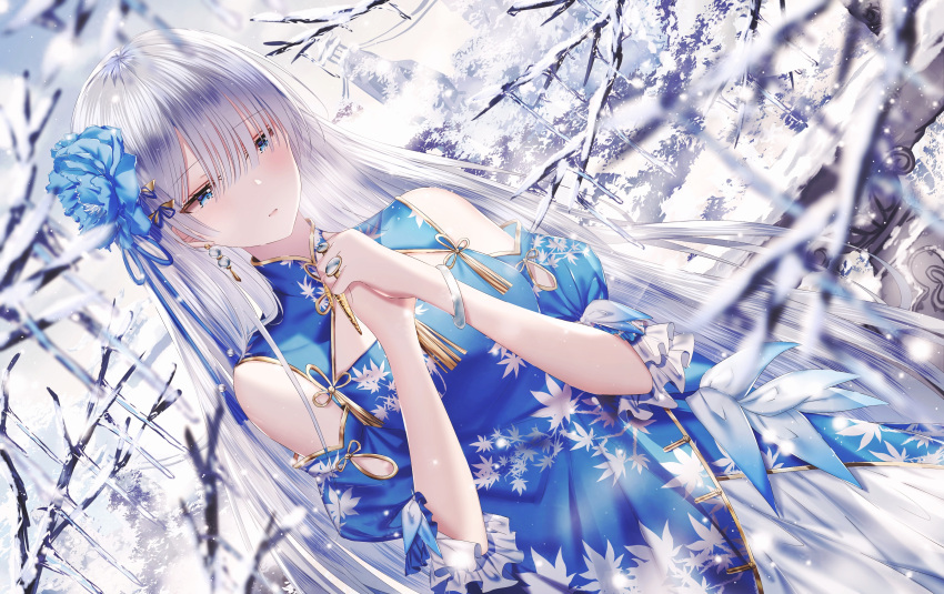 1girl absurdres anastasia_(fate/grand_order) bangs bare_shoulders blue_dress blue_eyes blue_flower blurry blurry_foreground blush clouds commentary_request day depth_of_field dress eyebrows_visible_through_hair fate/grand_order fate_(series) flower hair_flower hair_ornament hair_over_one_eye hands_together hands_up highres junpaku_karen leaf_print long_hair outdoors own_hands_together parted_lips print_dress puffy_short_sleeves puffy_sleeves short_sleeves shoulder_cutout silver_hair snow solo tree_branch very_long_hair