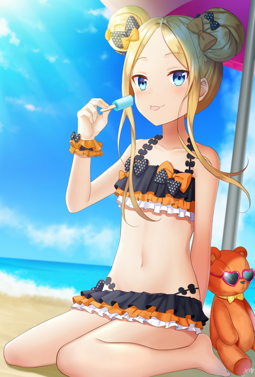 1girl :p abigail_williams_(fate/grand_order) bangs beach bikini black_bikini black_bow blonde_hair blue_eyes blue_sky blush bow closed_mouth clouds commentary_request day emerald_float eyebrows_visible_through_hair fate/grand_order fate_(series) fingernails food forehead hair_bow heart heart-shaped_eyewear highres holding holding_food horizon long_hair navel ocean orange_bow outdoors parted_bangs polka_dot polka_dot_bow popsicle purple-framed_eyewear saki_usagi sand sidelocks sitting sky smile solo stuffed_animal stuffed_toy sunglasses swimsuit teddy_bear tongue tongue_out wariza water wrist_cuffs