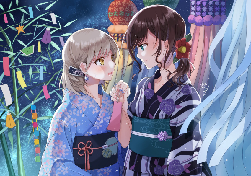 2girls bamboo black_hair blue_eyes blue_kimono blue_nails camellia commentary_request earrings eye_contact floral_print flower flower_knot hair_flower hair_ornament highres holding_hands japanese_clothes jewelry kimono light_brown_hair looking_at_another mole mole_under_mouth multiple_girls nail_polish nekozuki_yuki night obi original outdoors paper_chain ponytail red_flower sash sidelocks signature smile streamers tanabata tanzaku yellow_eyes yukata yuri