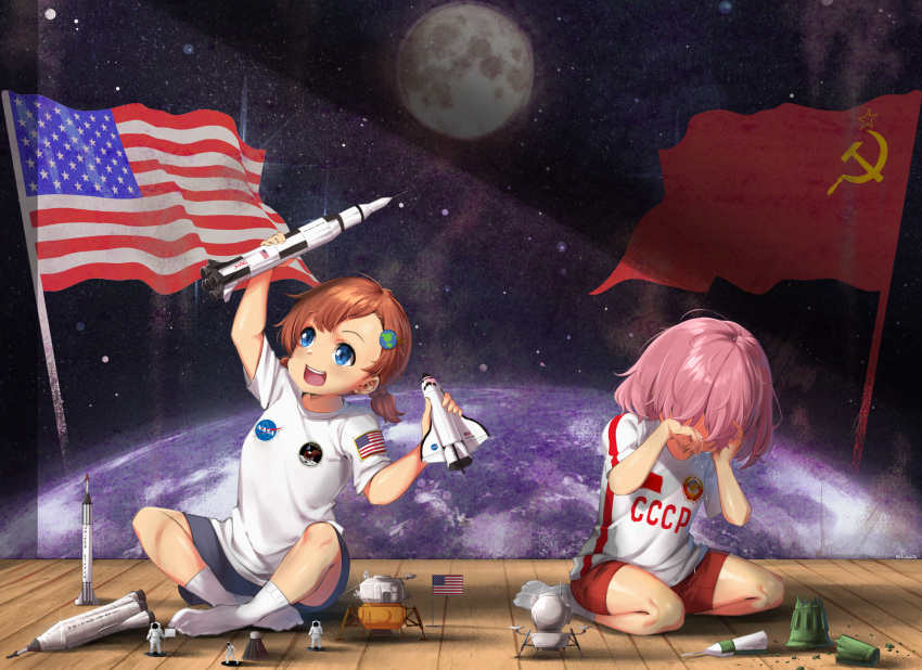 2girls :d american_flag astronaut bangs blue_eyes blue_shorts brown_hair commentary crying earth english_commentary full_moon hair_ornament highres lulu-chan92 medium_hair moon multiple_girls nasa on_floor open_mouth original personification pink_hair planet red_shorts rocket shirt short_hair shorts smile socks soviet soviet_flag space space_craft space_shuttle spacesuit t-shirt tears wooden_floor