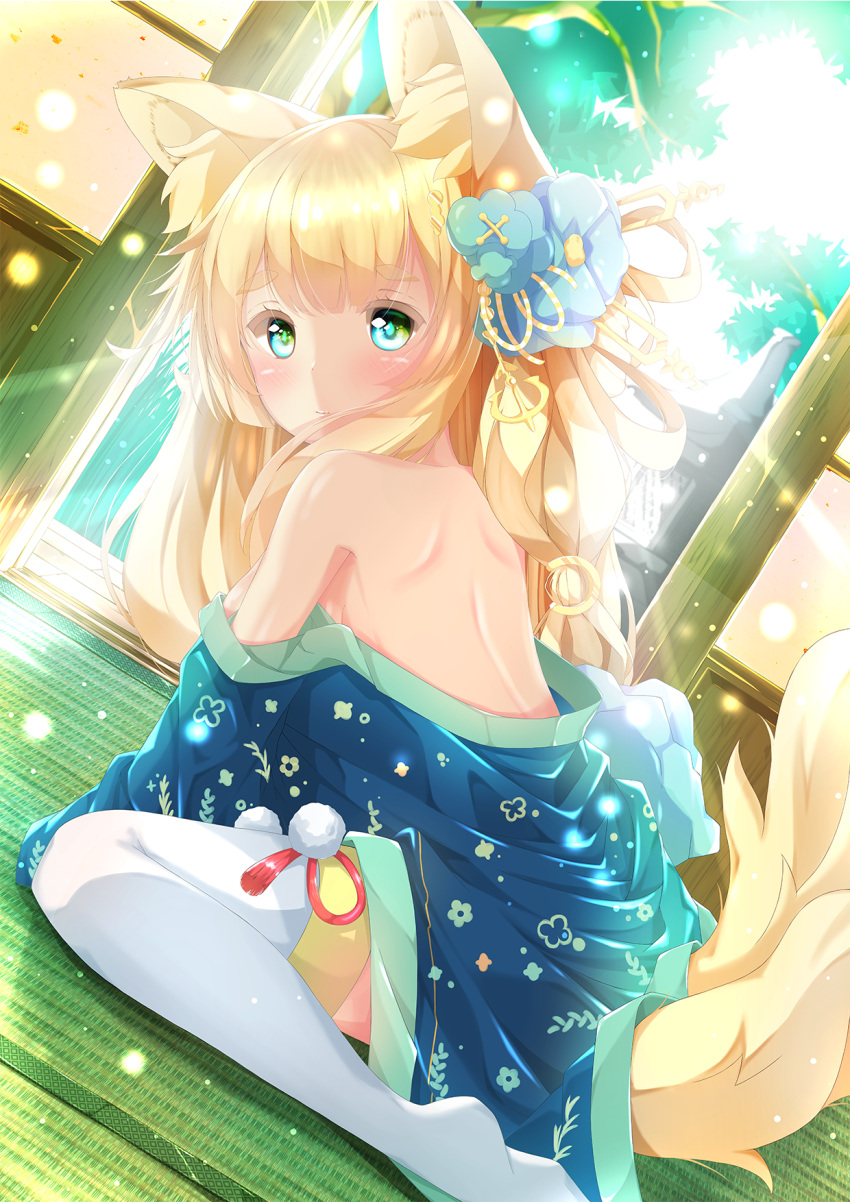 1girl animal_ear_fluff animal_ears azur_lane bangs bare_back bare_shoulders blonde_hair blue_eyes blush commentary_request day dutch_angle eyebrows_visible_through_hair flower from_behind green_eyes hair_flower hair_ornament highres indoors japanese_clothes kaoru-coro kimono long_hair looking_at_viewer multicolored multicolored_eyes niizuki_(azur_lane) off_shoulder shouji shoulder_blades sidelocks sitting sliding_doors solo sunlight tail tatami thick_eyebrows thigh-highs wariza white_legwear