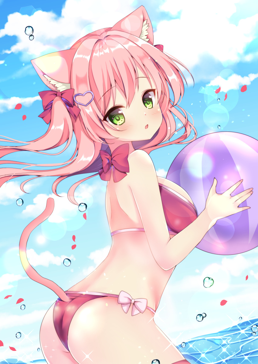 1girl absurdres animal_ear_fluff animal_ears ass ball bare_arms bare_shoulders beachball bikini blue_sky bow breasts cat_ears cat_tail clouds cloudy_sky day floating_hair from_side green_eyes hair_bow hair_ornament hamikoron heart highres holding long_hair looking_at_viewer looking_back medium_breasts original outdoors parted_lips petals pink_bow pink_hair red_bikini sky solo swimsuit tail two_side_up wading water