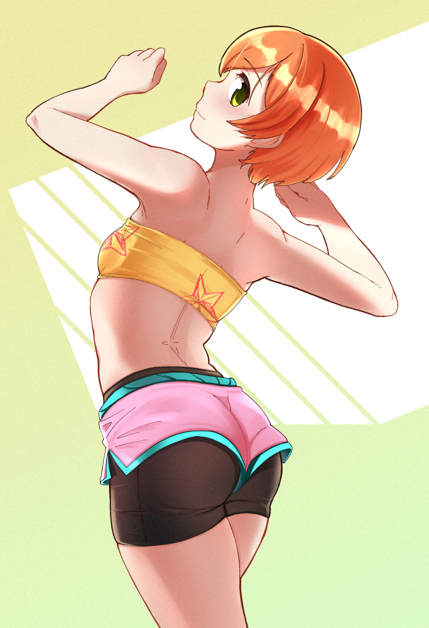 1girl arms_up ass back bandeau bangs bare_shoulders bike_shorts breasts cowboy_shot eyebrows_visible_through_hair from_behind green_background green_eyes highres hoshizora_rin layered_clothing looking_at_viewer looking_back love_live! love_live!_school_idol_project melonyogurt midriff orange_hair profile short_hair short_shorts shorts sideways_glance simple_background small_breasts smile solo sportswear yellow_eyes