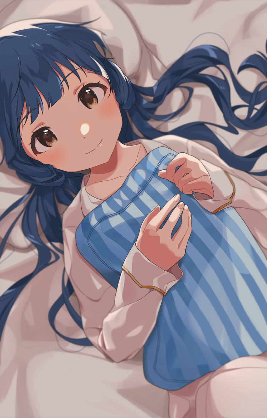 1girl bangs blue_hair blue_pillow brown_eyes collarbone commentary_request eyebrows_visible_through_hair highres idolmaster idolmaster_million_live! idolmaster_million_live!_theater_days kitakami_reika long_hair long_sleeves looking_at_viewer lying naijow on_back smile solo striped_pillow twintails