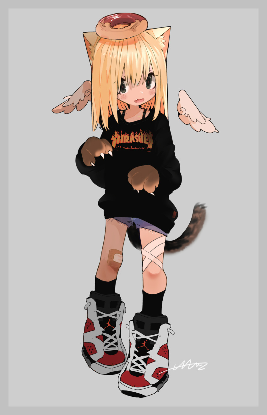 1girl absurdres animal_ears bandaid bandaid_on_knee black_legwear black_shirt blonde_hair blush cat_ears cat_paws cat_tail detached_wings doughnut fang food food_on_head full_body grey_background hair_between_eyes highres long_hair long_sleeves looking_at_viewer maymay_pic object_on_head on_head open_mouth original paws shirt shoes shorts signature simple_background socks solo standing tail thrasher_magazine wings