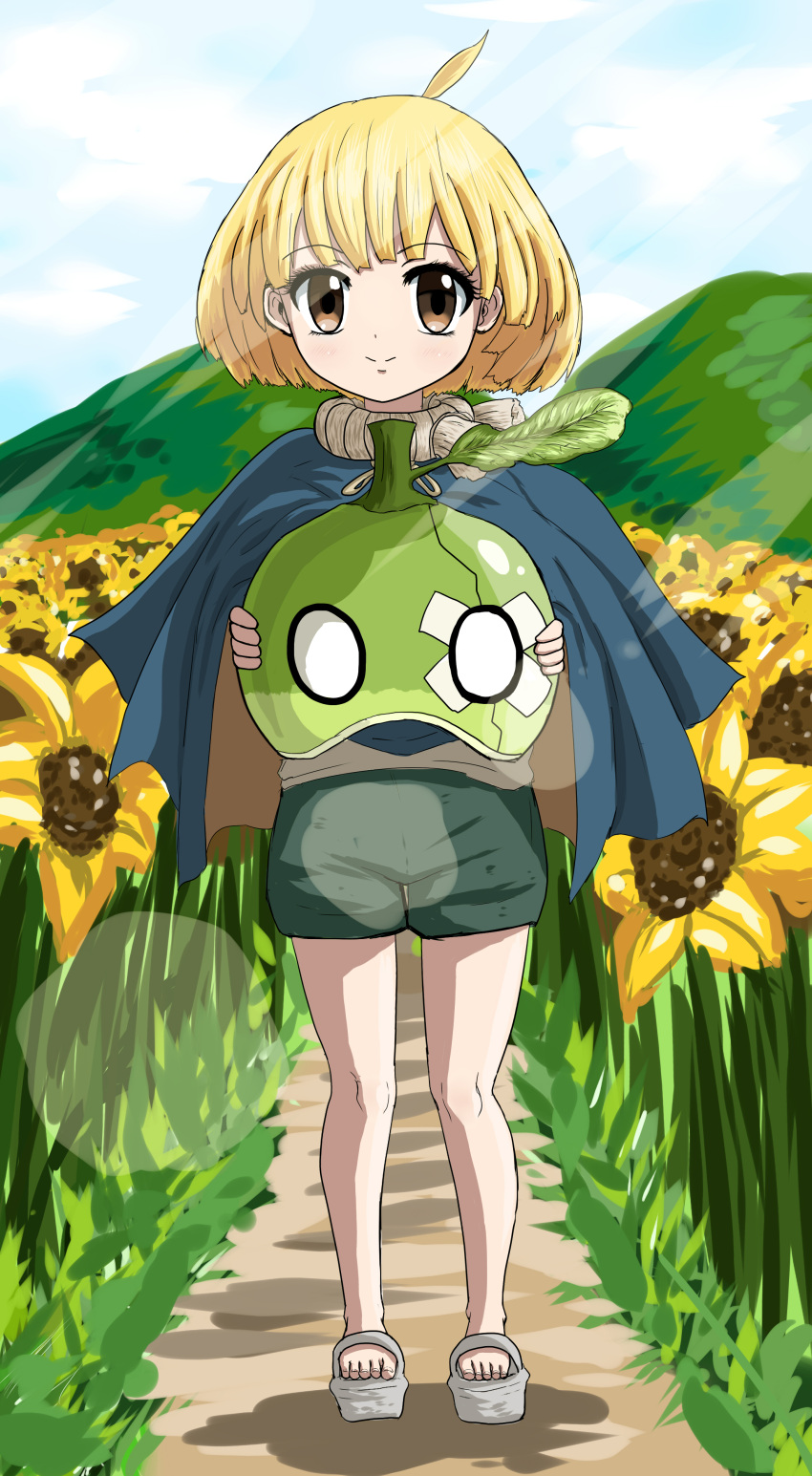 1girl absurdres ahoge barefoot_sandals blonde_hair bob_cut cape clouds cloudy_sky dr._stone english_commentary epicmilk flower food fruit full_body green_shorts highres holding holding_food holding_fruit jewelry leaf looking_at_viewer mountain necklace outdoors rope rope_necklace sandals short_hair shorts sky smile solo suika_(dr.stone) sunflower watermelon yellow_eyes