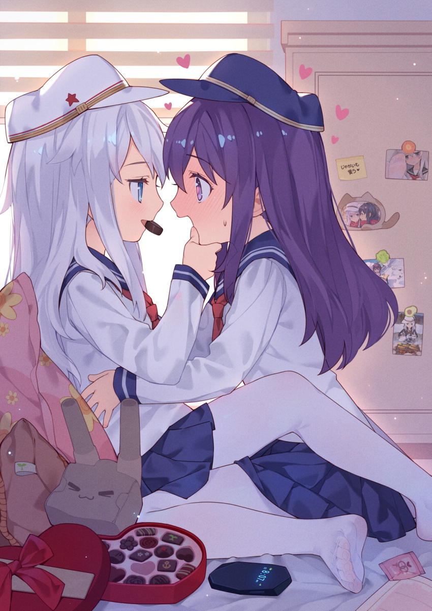 2girls :d akatsuki_(kantai_collection) backlighting bangs bed_sheet blue_eyes blue_headwear blue_sailor_collar blue_skirt box chocolate commentary_request eyebrows_visible_through_hair flat_cap food_in_mouth hair_between_eyes hand_on_another's_head hat heart heart-shaped_box hibiki_(kantai_collection) highres kantai_collection long_sleeves mouth_hold multiple_girls no_shoes open_mouth pantyhose pillow pleated_skirt profile purple_hair red_neckwear rensouhou-chan sailor_collar school_uniform see-through serafuku shirt silver_hair skirt smile soles star sweat toenails tsubasa_tsubasa venus_symbol verniy_(kantai_collection) violet_eyes white_headwear white_legwear white_shirt window yuri