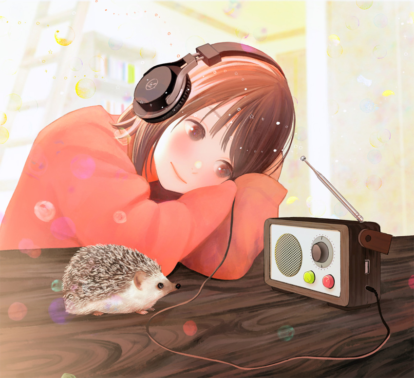 1girl blurry blurry_background blush brown_eyes brown_hair cable commentary_request head_on_arm headphones hedgehog listening nakamura_hinata original radio radio_antenna red_sweater short_hair solo sweater table